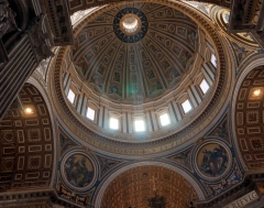 Rays of light shining through the dome of St Peter's, Vatican City