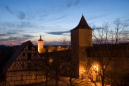 Rothenburg ob de Tauber's medieval wall and towers lit up